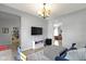 Comfortable living room with stylish decor, bright window, and open to other rooms at 13485 Mancroft Dr, Fishers, IN 46037