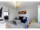 Comfortable living room with stylish decor, bright window, and open to other rooms at 13485 Mancroft Dr, Fishers, IN 46037