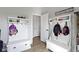 Hall tree with hooks and storage, enhancing the mudroom's functionality and organization at 13485 Mancroft Dr, Fishers, IN 46037