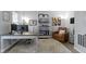 Comfortable home office with plush rug, desk, shelving, and cozy leather armchair at 13485 Mancroft Dr, Fishers, IN 46037