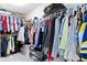 Organized walk-in closet with double hanging rods and plenty of space for storage at 13485 Mancroft Dr, Fishers, IN 46037