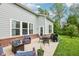 Outdoor patio featuring comfortable seating, a dining table, grill and well-maintained lawn at 14458 Carlow Run, Carmel, IN 46074