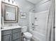 Bathroom with a single vanity, neutral colors, tub with shower, and neutral colors at 14458 Carlow Run, Carmel, IN 46074