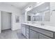 Bathroom with double vanity, a large mirror, and access to the walk-in shower at 14458 Carlow Run, Carmel, IN 46074
