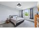 Modern bedroom featuring curtains, a light fixture and a comfortable bed at 14458 Carlow Run, Carmel, IN 46074