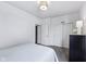 Bright bedroom with a modern light fixture and a dresser with a white lamp at 14458 Carlow Run, Carmel, IN 46074