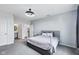 Large primary bedroom with two doorways and a comfortable bed at 14458 Carlow Run, Carmel, IN 46074