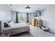 Modern bedroom with a window, television, dresser and a comfortable bed at 14458 Carlow Run, Carmel, IN 46074