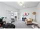 Cozy living room with neutral carpeting, a comfortable armchair, and French doors leading to another room at 14458 Carlow Run, Carmel, IN 46074