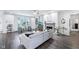Bright living room featuring hardwood floors, a fireplace, and modern furniture at 14458 Carlow Run, Carmel, IN 46074