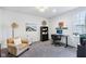 Comfortable home office with modern desk setup, neutral carpet, and cozy furniture at 14458 Carlow Run, Carmel, IN 46074