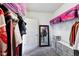 Spacious walk-in closet with shelving, racks, and storage drawers with carpet floors at 14458 Carlow Run, Carmel, IN 46074