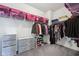 Walk-in closet with ample storage including shelving, hanging racks, and storage drawers at 14458 Carlow Run, Carmel, IN 46074