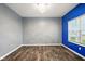 This bedroom features laminate floors, neutral walls, and a stylish chandelier lighting fixture at 1454 Silver Pine Ln, Sheridan, IN 46069