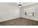 Bright bedroom features plush carpet, a window, and a stylish chandelier at 1454 Silver Pine Ln, Sheridan, IN 46069