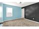 Bedroom with carpet, bright white trim, neutral-tone walls and contemporary light fixture at 1454 Silver Pine Ln, Sheridan, IN 46069