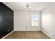Neutral bedroom with a modern light fixture and a window at 1454 Silver Pine Ln, Sheridan, IN 46069