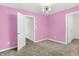 Bright pink bedroom featuring carpeted floors, modern light fixture and bright white trim at 1454 Silver Pine Ln, Sheridan, IN 46069