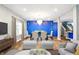 Bright dining room area with a modern chandelier and bold accent wall at 1454 Silver Pine Ln, Sheridan, IN 46069