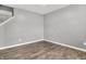 A versatile, vacant room with wood flooring, ready to be customized to your needs at 1454 Silver Pine Ln, Sheridan, IN 46069