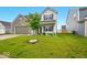 Shot of the front exterior with well kept lawn, landscaping and manicured tree at 1454 Silver Pine Ln, Sheridan, IN 46069
