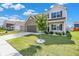 Beautiful two-story home with a manicured lawn, landscaped garden, and a brick and siding exterior at 1454 Silver Pine Ln, Sheridan, IN 46069