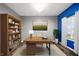 Inviting home office with a wooden desk and a full bookcase at 1454 Silver Pine Ln, Sheridan, IN 46069