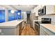 Modern kitchen with stainless steel appliances, quartz countertops, and a center island at 1454 Silver Pine Ln, Sheridan, IN 46069