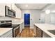 Contemporary kitchen with white cabinets, stainless steel appliances, and tiled backsplash at 1454 Silver Pine Ln, Sheridan, IN 46069