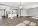 Bright, open living area featuring modern lighting and stylish design with easy access to the kitchen at 1454 Silver Pine Ln, Sheridan, IN 46069