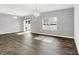 Open living space with lots of natural light, leading to a patio with bright light and luxury plank flooring at 1454 Silver Pine Ln, Sheridan, IN 46069