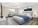 A beautifully staged main bedroom boasts plenty of natural light and stylish decor at 1454 Silver Pine Ln, Sheridan, IN 46069