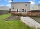 Backyard featuring a wooden deck, gravel area, and lawn at 15110 Fawn Hollow Ln, Noblesville, IN 46060