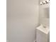 A compact bathroom features a modern vanity, mirror, and contemporary lighting at 15110 Fawn Hollow Ln, Noblesville, IN 46060