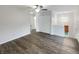 Large bedroom showcasing wood-look floors, a ceiling fan, and access to multiple closets at 15110 Fawn Hollow Ln, Noblesville, IN 46060