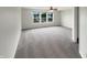 Bright bedroom with large windows and plush gray carpeting at 15110 Fawn Hollow Ln, Noblesville, IN 46060