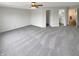 Large bedroom with plush carpet, ceiling fan, and access to bathroom and closet at 15110 Fawn Hollow Ln, Noblesville, IN 46060