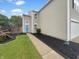 View of a two-story home showcasing a blue front door, landscaped yard, and attached garage at 15110 Fawn Hollow Ln, Noblesville, IN 46060
