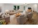 Sunlit living room featuring stylish furniture, hardwood floors, and a welcoming ambiance at 15110 Fawn Hollow Ln, Noblesville, IN 46060