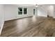 Spacious living room featuring hardwood floors, natural light and neutral color palette at 15110 Fawn Hollow Ln, Noblesville, IN 46060