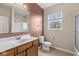 Bathroom featuring a large mirror, updated vanity, and a shower-tub combo at 15421 Bowie Dr, Westfield, IN 46074