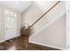 Inviting entryway with hardwood floors, a staircase, and a charming accent table at 15421 Bowie Dr, Westfield, IN 46074