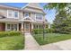 Charming two-story home with a well-manicured lawn and inviting front porch with brick and shake siding at 15421 Bowie Dr, Westfield, IN 46074
