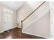 Hardwood foyer featuring a white front door and staircase with wood railing at 15421 Bowie Dr, Westfield, IN 46074