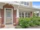 Inviting front porch with brick pillars, a neutral front door, and well-maintained landscaping at 15421 Bowie Dr, Westfield, IN 46074