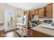 Functional kitchen featuring wooden cabinets, stainless steel appliances, and access to the backyard at 15421 Bowie Dr, Westfield, IN 46074