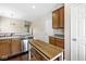 Well-lit kitchen with stainless steel appliances and an island table with built-in bench seating at 15421 Bowie Dr, Westfield, IN 46074