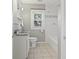 Bathroom featuring a marble-topped vanity, updated fixtures, and a tiled shower and tub at 1720 Woodlawn Ave, Indianapolis, IN 46203