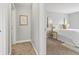 View into the spacious bedroom featuring soft carpet, light walls, and great lighting at 1720 Woodlawn Ave, Indianapolis, IN 46203