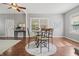 Cozy dining area with hardwood floors, gray walls and natural light from the windows at 1720 Woodlawn Ave, Indianapolis, IN 46203